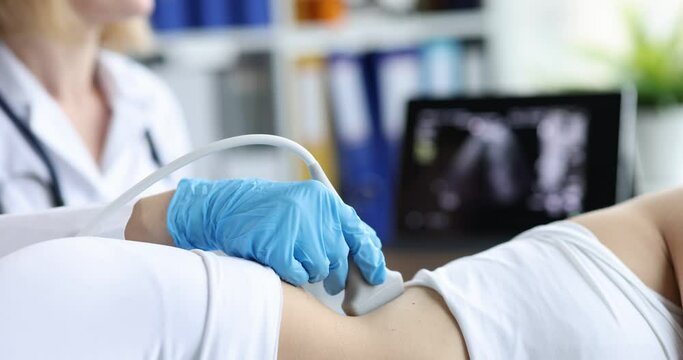 Process of conducting ultrasound session and examining kidneys doctor to patient. Diagnosis of diseases of the kidneys and urinary tract concept