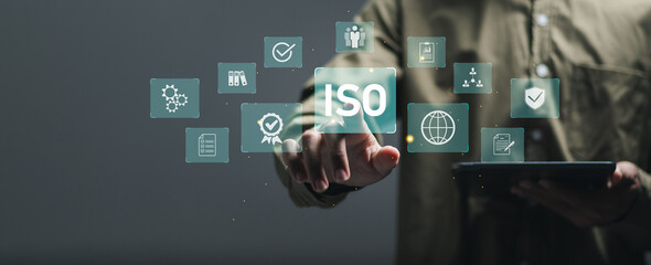 ISO standards quality control. Businessman use tablet with quality assurance or guarantee product....