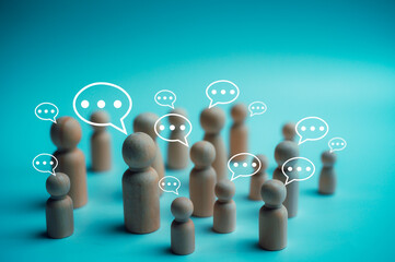 lifestyle and social media concept Social gathering with text message bubbles and icons on wooden dolls