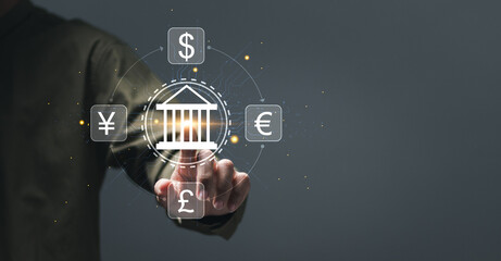 Online banking interbank payment concept. Businessman touching virtual online banking icon for money transfers and currency exchanges between countries of the world, central bank and foreign currency.