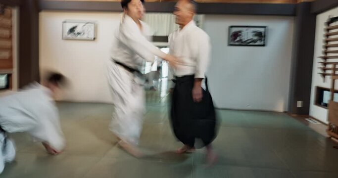 Fitness, karate and people in dojo for kung fu for sports, discipline or self defense for focus or honor. Training, workout and serious martial arts students in facility for fighting exercise.