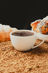 A cup of instant coffee granules and scones. Beautiful and delicious breakfast.