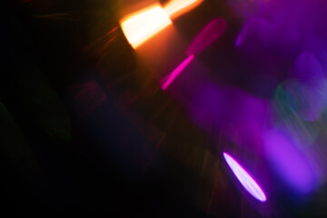 Blurred Light painting one exposure in camera. light glares with a spectral gradient on a dark...