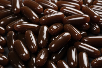 Sunflower lecithin in capsules background. Lecithin in brown capsules close up. alternative medicine, medicinal product