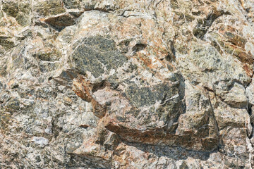 Texture of raw block of natural stone of greenish tint