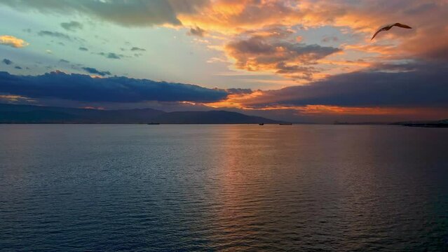 Over the sea with drone at sunset in the evening 4k video