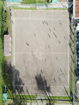 football field with players photographed from above with a drone