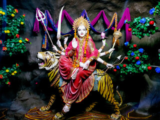 Goddess Durga idol at decorated Navratri festival pandal.