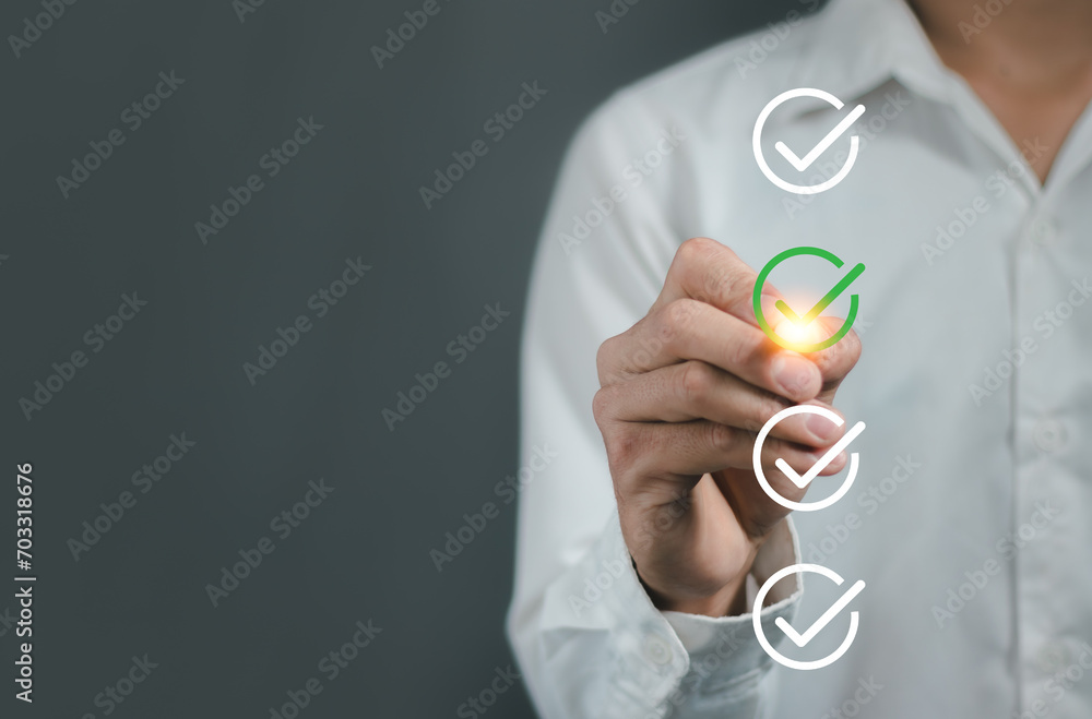 Poster businessman using pen to tick correct sign mark in checkbox for quality document control checklist ,