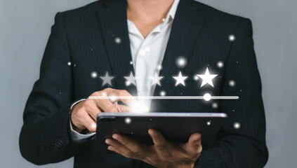 Client holding smartphone to review feedback to give five stars rating for customer evaluation and...
