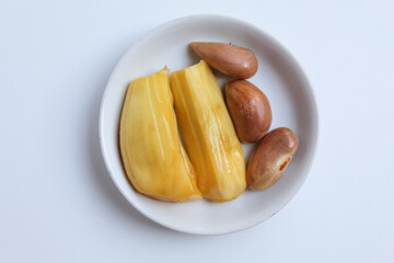 Yellow Jackfruit flesh and its seed from Artocarpus heterophyllus, isolated on white background, flat lay or top view