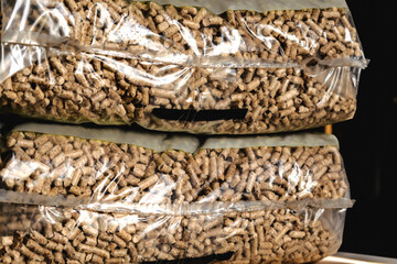 Stack of pellet bags, renewable energy, compressed wood, alternative lifestyle