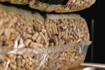 Stack of pellet bags, renewable energy, compressed wood, alternative lifestyle