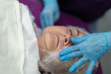 Close-up of the face of a patient of a cosmetic surgery facility.