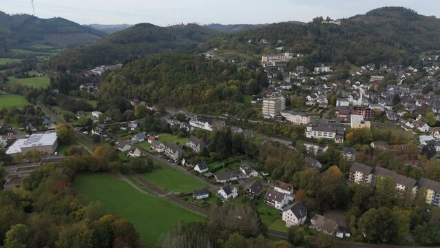 Drone flight over the mountains of Hesse with a small village in between