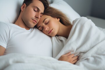 Good quality productive sleep is a concept. Generated by AI. A young couple in love sleeps lying in a warm cozy bed hug each other, dreams and recovers strength and energy. White bed linen.