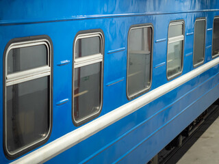 Detail of blue train with closed windows