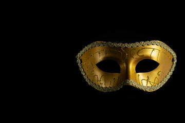 Carnival mask, a vintage accessory suitable for opera or theater, black background, copy space