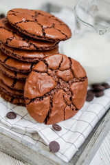Brownie crinkle chewie cookie homemade with chocolate on white whooden background close up selective focus 