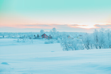 Fototapeta premium Beautiful winter landscape with snow-covered trees and houses.