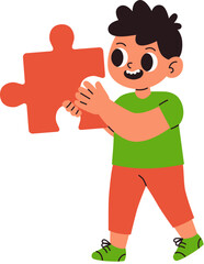 Little boy holding a piece of a puzzle