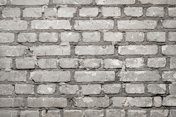 Close-up of flat brick wall with rows of cement concrete bricks as background