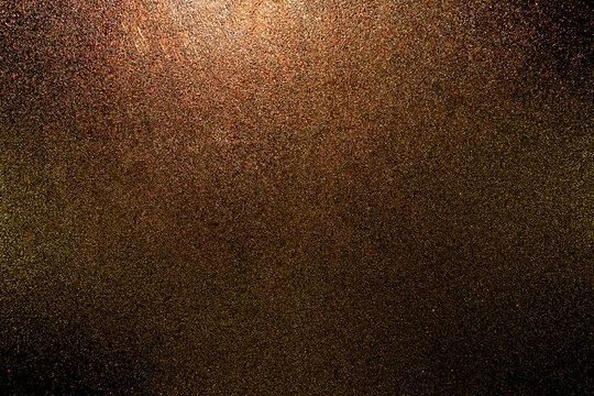 Black dark orange golden red brown shiny glitter abstract background with space. Twinkling glow stars effect. Like outer space, night sky, universe. Rusty, rough surface, grain.