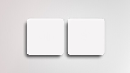 Mockup of two blank square business cards on a gray background