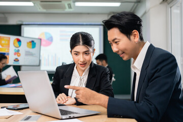 Asian business people team analyzing statistics financial. Team of businesspeople Meeting Conference Discussion Corporate Concept in office.