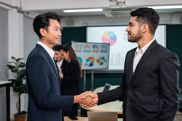 Asian business people team analyzing statistics financial. Team of businesspeople Meeting Conference Discussion Corporate Concept in office.