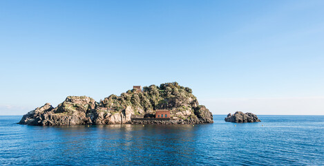 Fototapeta na wymiar Suggestive panoramic island of Lachea in the protected marine reserve of the Cyclops Riviera