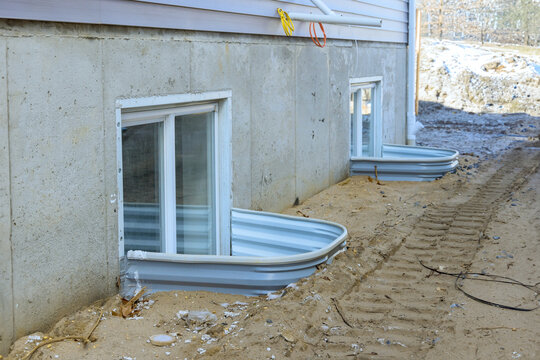 Adding window well to basement of new house under construction
