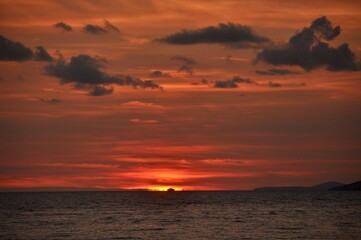 Fototapeta na wymiar Beautiful red sky with sea in the foreground. Sunset over the sea in Croatia. 