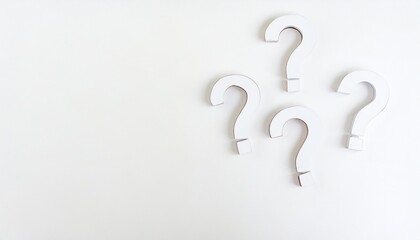 Naklejka premium three white question marks symbol on white floor flat lay top view from above with copy space question faq or brainstorming concept