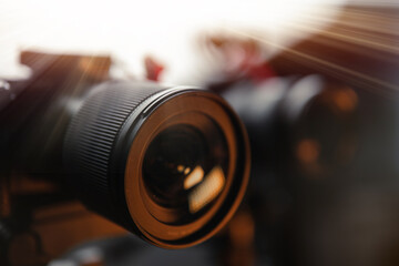 The lens glass is close Video cameras on tripods, selective focus, Studio soft box, light. Filming,...