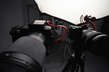 Video cameras on tripods, selective focus, Studio soft box, light. Filming, work of a videographer....