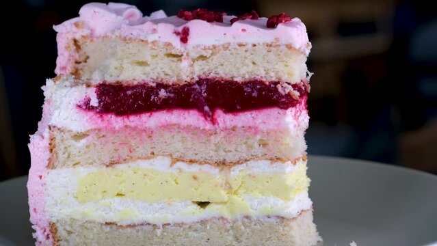 strawberry poppy cake with cream in a plate on aon a blue background. High quality 4k footage