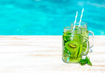 Homemade lemonade on wooden background