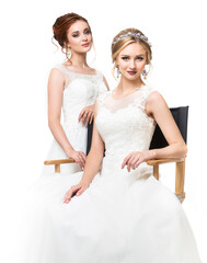 Two young caucasian pretty brides in studio