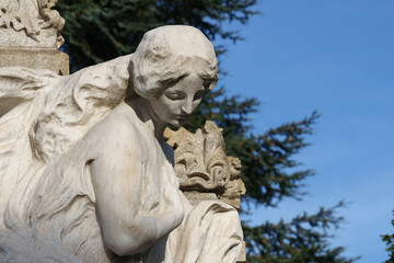 Fototapeta na wymiar Cimitero Monumentale, historic cemetery in Milan, Italy. A tomb