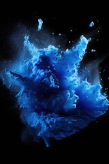 Explosion of blue colored powder on black background