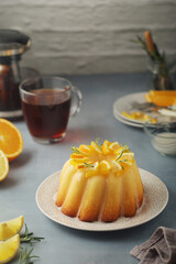 A sweet citrus cake served with oranges and lemons	