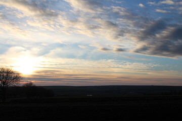 A sunset over a field