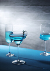 Glasses with blue alcohol cocktail ready for a party	
