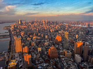 Aerial panoramic view over New-York skyline and Hudson river from One World Observatory deck at One World Trade Center, Winter Sunset
