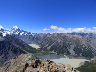Mueller hut track, Aoraki National park, New Zealand. Southern Alps and Mt. Cook in the background, glacial lake in the front. Sunny day in the summer with clear skies and beautiful view.