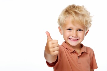 Portrait of happy child boy showing thumbs up gesture, isolated over white background