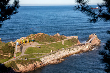 Salinas beach seen from above and its open-air anchor museum

