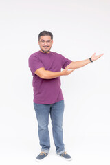 A smart middle aged man eagerly presenting something to the right. Wearing a purple waffle shirt and jeans. Full body photo, isolated on a white background.