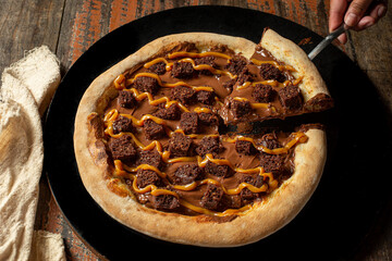 chocolate pizza with brownie. delicious chocolate brownie and caramel pizza. Brazilian pizza